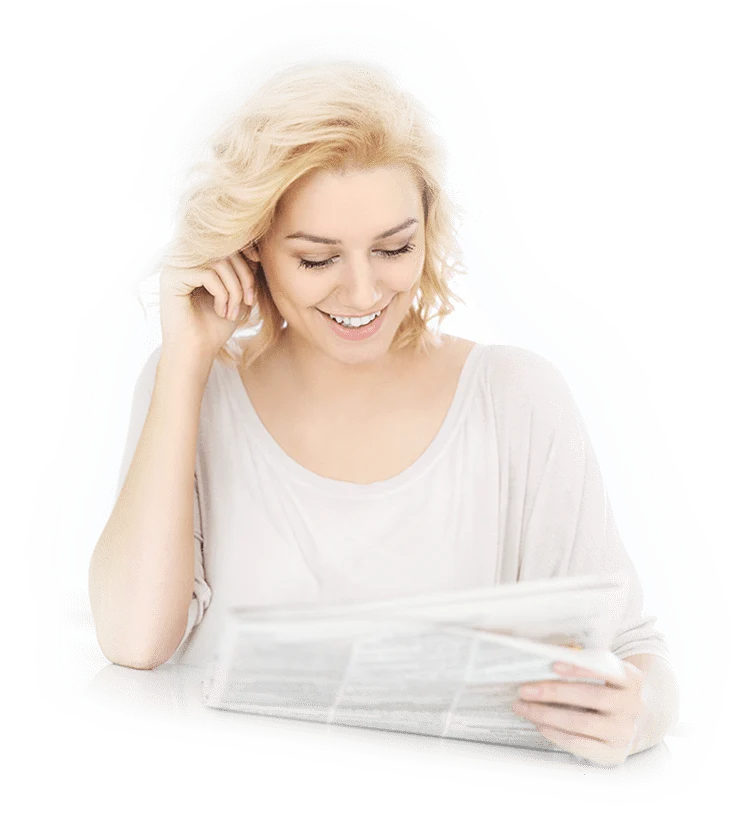 Happy woman reading about chiropractic health tips at Synergy Wellness Group Kanata